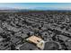An aerial view shows a home with desert landscaping in a planned community at 2177 Magnolia Pond Ct, Henderson, NV 89052