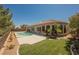 A large yard with an inviting swimming pool and desert landscaping at 2177 Magnolia Pond Ct, Henderson, NV 89052