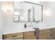 Elegant bathroom with marble countertop vanity and decorative lighting at 2177 Magnolia Pond Ct, Henderson, NV 89052