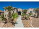Charming single-story home with desert landscaping, rock garden, and a cozy entryway at 2177 Magnolia Pond Ct, Henderson, NV 89052