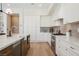 Bright kitchen features stainless appliances, white cabinets, and marble countertops at 2177 Magnolia Pond Ct, Henderson, NV 89052