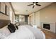 Well-lit main bedroom showcasing elegant design elements and cozy fireplace at 2177 Magnolia Pond Ct, Henderson, NV 89052