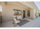 Covered patio with neutral furniture and patterned rug, perfect for outdoor relaxation at 2177 Magnolia Pond Ct, Henderson, NV 89052