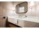 Chic powder room features a floating vanity and decorative mirror at 2177 Magnolia Pond Ct, Henderson, NV 89052