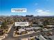 Aerial view of the home with a pool, mature trees, and proximity to downtown Las Vegas at 2211 Frontier Ave, Las Vegas, NV 89106