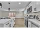 Well-designed kitchen with a central island, stainless steel appliances and a view to the backyard through french doors at 2211 Frontier Ave, Las Vegas, NV 89106