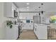 Beautiful kitchen with white cabinets, stainless steel appliances, and a stylish central island at 2211 Frontier Ave, Las Vegas, NV 89106