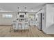 Bright kitchen features white cabinets, stainless steel appliances, and a center island with barstool seating at 2211 Frontier Ave, Las Vegas, NV 89106