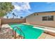 Large backyard pool features a diving board and ladder for outdoor enjoyment at 2211 Frontier Ave, Las Vegas, NV 89106