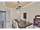 Modern dining room features a stylish light fixture, elegant decor, and seating for eight at 2382 Sunburst View St, Henderson, NV 89052