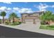 Lovely two-story home featuring a three-car garage, desert landscaping, and great curb appeal at 2382 Sunburst View St, Henderson, NV 89052