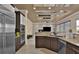 Modern kitchen with stainless steel appliances and a seamless flow to the living area at 2382 Sunburst View St, Henderson, NV 89052