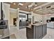 Open kitchen featuring stainless steel appliances, a large island, and modern cabinetry at 2382 Sunburst View St, Henderson, NV 89052