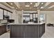 Stylish kitchen featuring stainless steel appliances, granite counters, and island with bar seating at 2382 Sunburst View St, Henderson, NV 89052