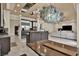 Open-concept living area with modern kitchen, fireplace, and comfortable seating at 2382 Sunburst View St, Henderson, NV 89052