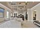Bright living room featuring modern lighting, neutral tones, and a spacious layout at 2382 Sunburst View St, Henderson, NV 89052