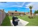 Spacious backyard with ample seating and a lush lawn, perfect for outdoor entertaining at 239 Concho Dr, Henderson, NV 89015