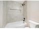 Modern bathroom featuring a soaking tub with stylish tile surround and matte black fixtures at 239 Concho Dr, Henderson, NV 89015
