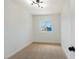 Cozy bedroom with plush carpeting and a window providing natural light at 239 Concho Dr, Henderson, NV 89015