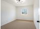 Well-lit bedroom featuring comfortable carpet and bright, natural light at 239 Concho Dr, Henderson, NV 89015