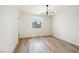 Sun-filled bedroom with hardwood floors and a window offering views of the outdoors at 239 Concho Dr, Henderson, NV 89015