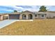 Charming single-story home with desert landscaping, arched entryways, and a two-car garage at 239 Concho Dr, Henderson, NV 89015