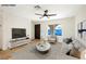 Cozy living room featuring neutral paint, wood-look flooring, and modern furnishings at 239 Concho Dr, Henderson, NV 89015
