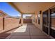 Covered back patio with concrete flooring and gravel landscaping offers privacy at 240 Vineyard Ln, Mesquite, NV 89027
