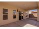 Backyard featuring a covered patio, concrete floor, privacy wall, and xeriscaped landscaping at 240 Vineyard Ln, Mesquite, NV 89027