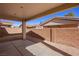 View of the backyard, highlighting the concrete patio and xeriscaped landscaping at 240 Vineyard Ln, Mesquite, NV 89027