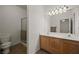 Bathroom with double sink vanity, a toilet and a glass door shower at 240 Vineyard Ln, Mesquite, NV 89027