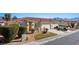 Inviting single-story home featuring a well-maintained yard, desert landscaping, and a two-car garage at 240 Vineyard Ln, Mesquite, NV 89027