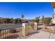View of the front porch and street with desert landscaping and mature trees at 240 Vineyard Ln, Mesquite, NV 89027