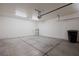 Spacious garage with concrete floors and ample room for parking and storage, with overhead lighting at 240 Vineyard Ln, Mesquite, NV 89027