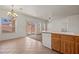 Open-concept kitchen with tile flooring, island sink, and sliding door access to backyard at 240 Vineyard Ln, Mesquite, NV 89027