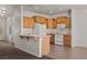 Kitchen featuring wood cabinets, white appliances, and bar style counter seating at 240 Vineyard Ln, Mesquite, NV 89027