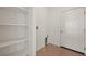 Laundry room with tile flooring, built-in shelves, and exterior access, offering convenience and functionality at 240 Vineyard Ln, Mesquite, NV 89027