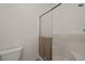 Shower stall with glass door and a toilet at 240 Vineyard Ln, Mesquite, NV 89027