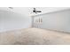 Bedroom with plush gray carpet, neutral walls, ceiling fan and window at 2482 Denholme St, Henderson, NV 89044