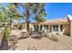 Backyard with desert landscaping and exterior views of the house at 2509 Banora Point Dr, Las Vegas, NV 89134