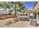 Landscaped backyard featuring desert landscaping and an exterior air conditioning unit at 2509 Banora Point Dr, Las Vegas, NV 89134