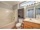A well-lit bathroom featuring a tub/shower, toilet, and vanity with a mirror at 2509 Banora Point Dr, Las Vegas, NV 89134
