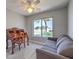 Cozy bedroom featuring a wooden desk with seating and a comfortable couch at 2509 Banora Point Dr, Las Vegas, NV 89134