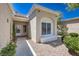 Inviting front entry with rock landscaping and tiled roof and trim at 2509 Banora Point Dr, Las Vegas, NV 89134