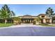 Striking building exterior with unique architectural details and lush landscaping, creating an inviting ambiance at 2509 Banora Point Dr, Las Vegas, NV 89134