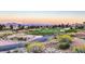 Scenic golf course view with well-manicured greens, sand traps and Las Vegas skyline in the distance at 2509 Banora Point Dr, Las Vegas, NV 89134
