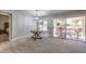 Living room with new carpet, sliding door to backyard, and views of yard at 2509 Banora Point Dr, Las Vegas, NV 89134