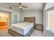 Main bedroom featuring a king bed and view to ensuite bathroom and walk-in closet at 2509 Banora Point Dr, Las Vegas, NV 89134