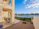 Backyard area featuring a small patio with seating offering views of the lake at 2521 Seascape Dr, Las Vegas, NV 89128