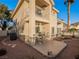 Scenic backyard featuring a small patio with seating and desert landscaping at 2521 Seascape Dr, Las Vegas, NV 89128